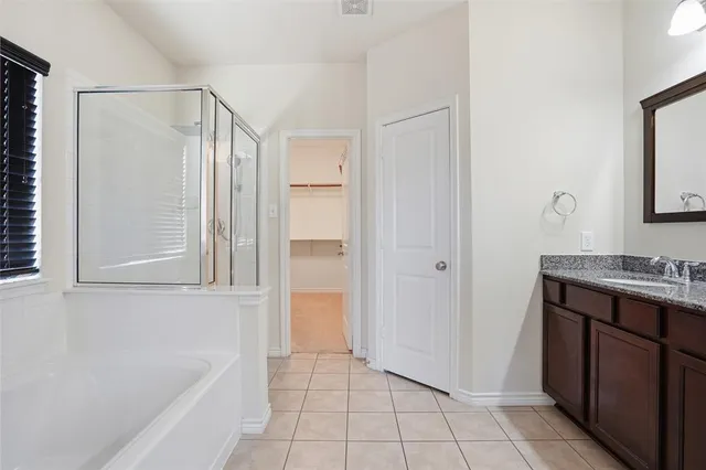 a bathroom with a bathtub and a sink