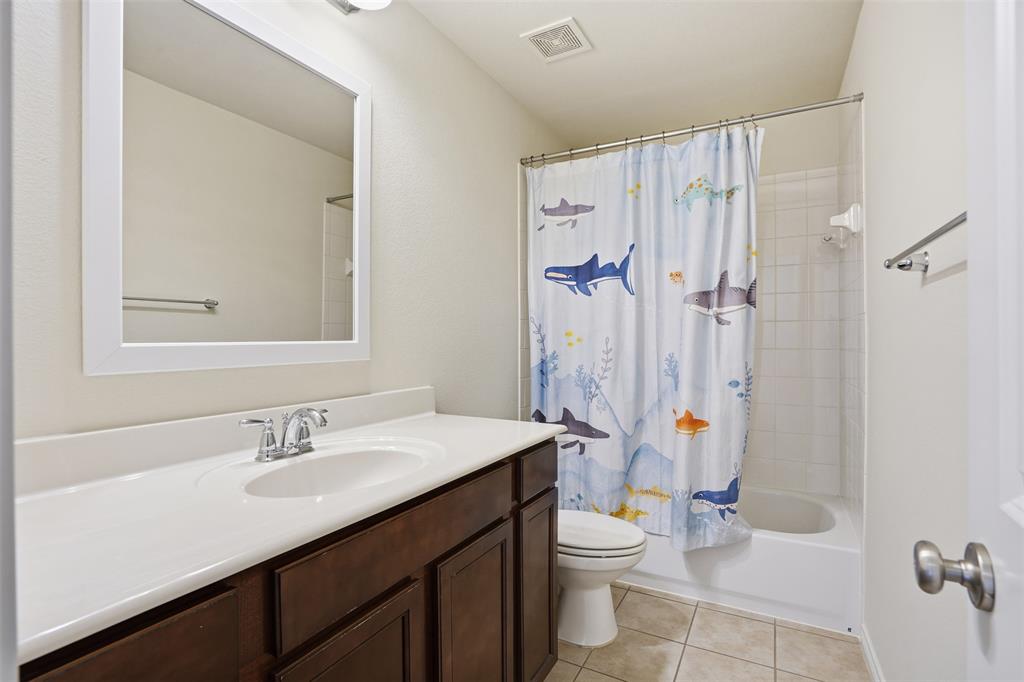 3913 Weatherstone Drive Fort Worth, TX 76137 - Photo 14 of 20 a bathroom with a sink toilet and shower