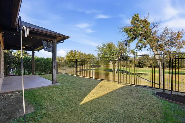 a view of backyard with green space