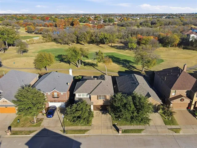 an aerial view of houses with outdoor space