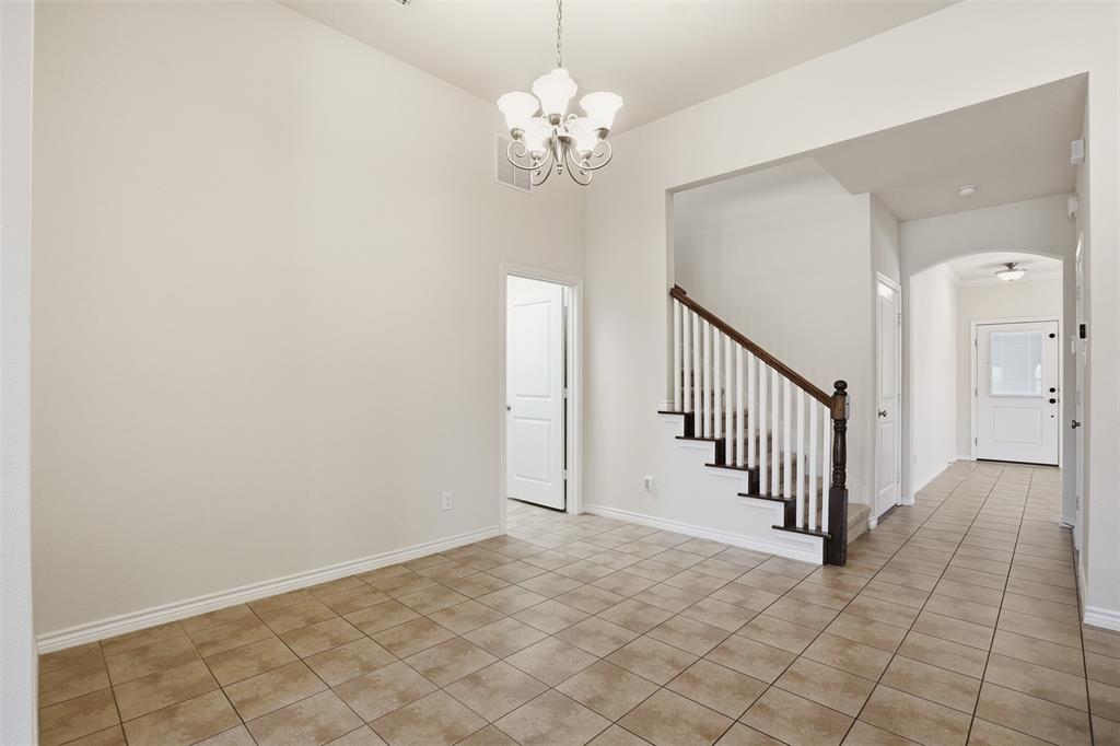 3913 Weatherstone Drive Fort Worth, TX 76137 - Photo 6 of 20 wooden floor in a hall with a chandelier