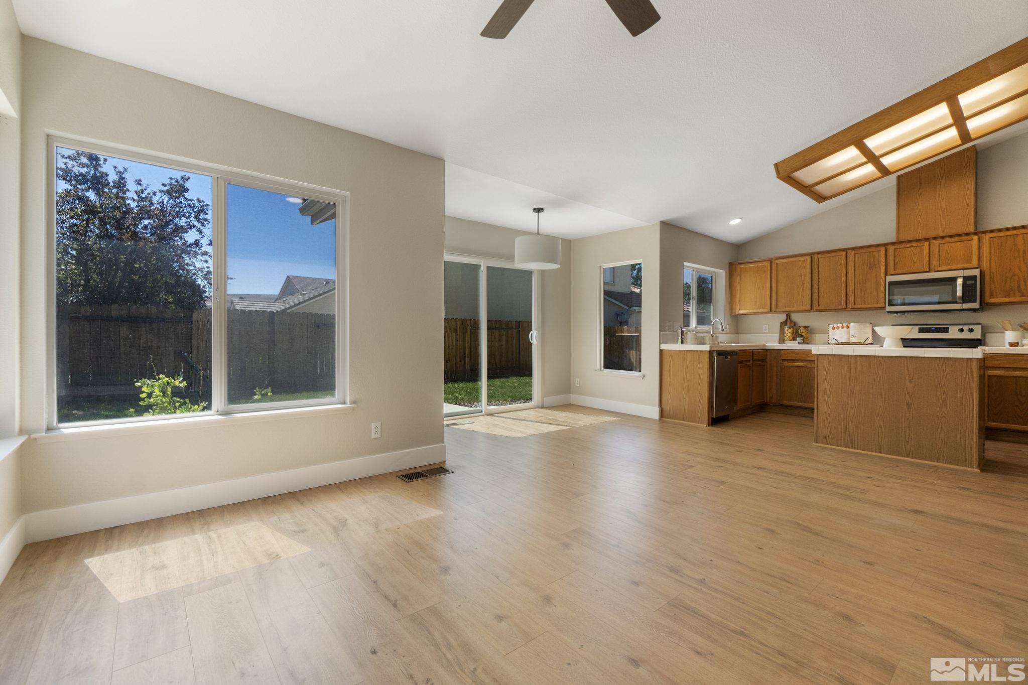 9721 Northmont Lane Reno, NV 89521 - Photo 3 of 40 a view of a kitchen with a sink and a large window