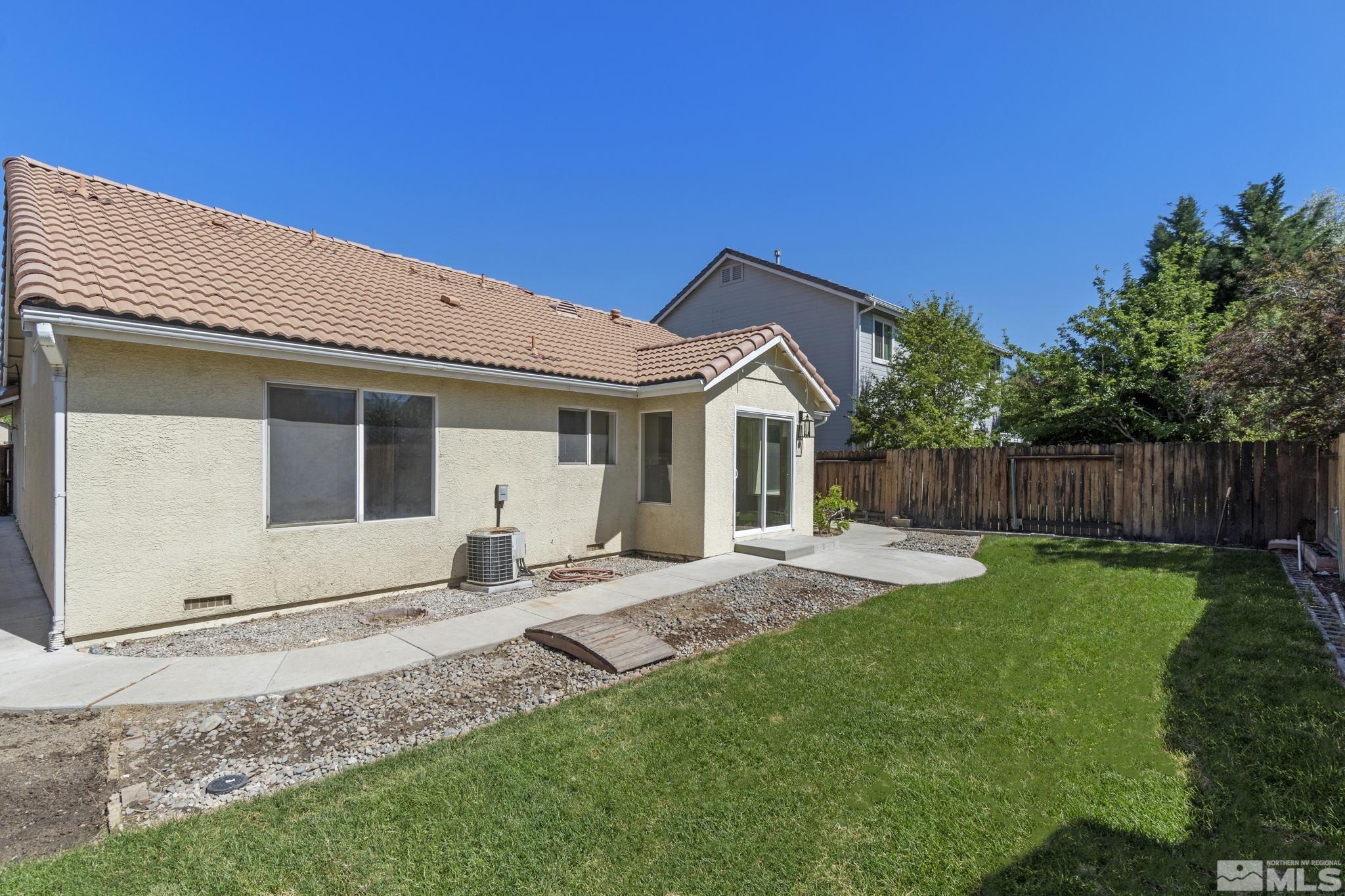 9721 Northmont Lane Reno, NV 89521 - Photo 31 of 40 a front view of a house with garden