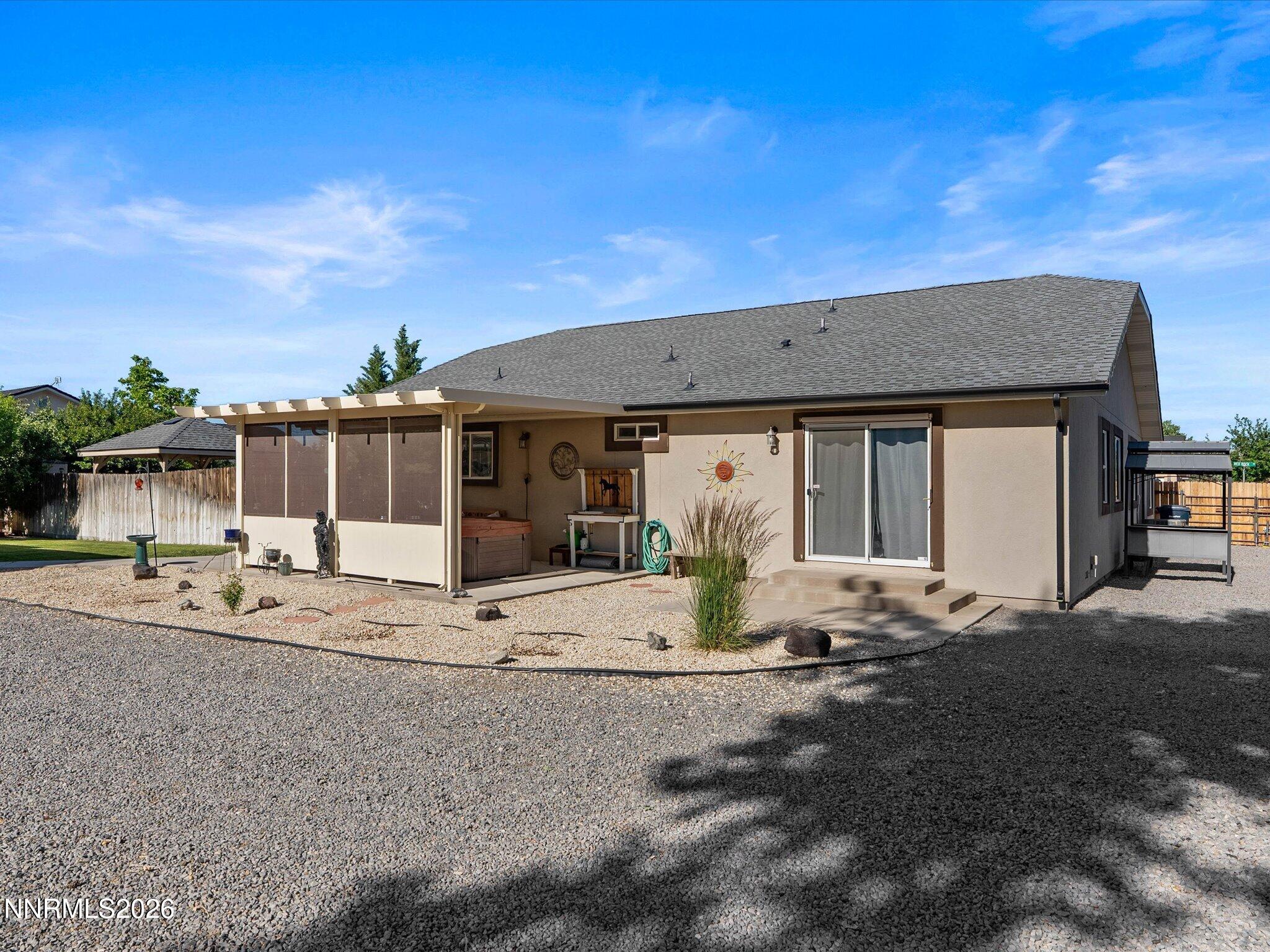 1080 Red Rock Road Fernley, NV 89408 - Photo 42 of 45 a front view of a house with basket ball court and seating area