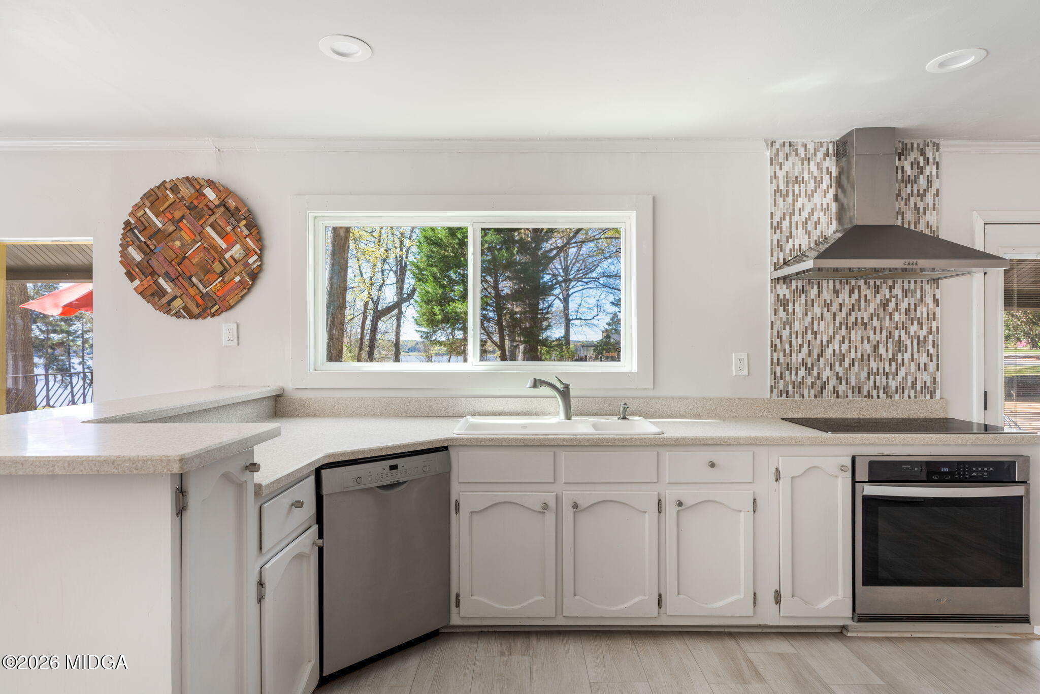 138 Deer Run Drive Macon, GA 31220 - Photo 12 of 114 a kitchen with a sink cabinets and a large window