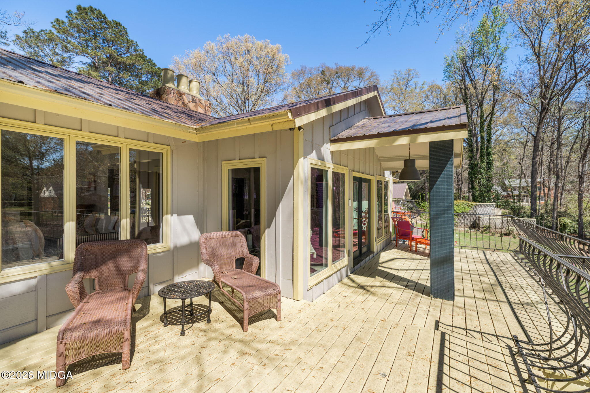138 Deer Run Drive Macon, GA 31220 - Photo 48 of 114 a view of a patio with table and chairs potted plants and floor to ceiling window