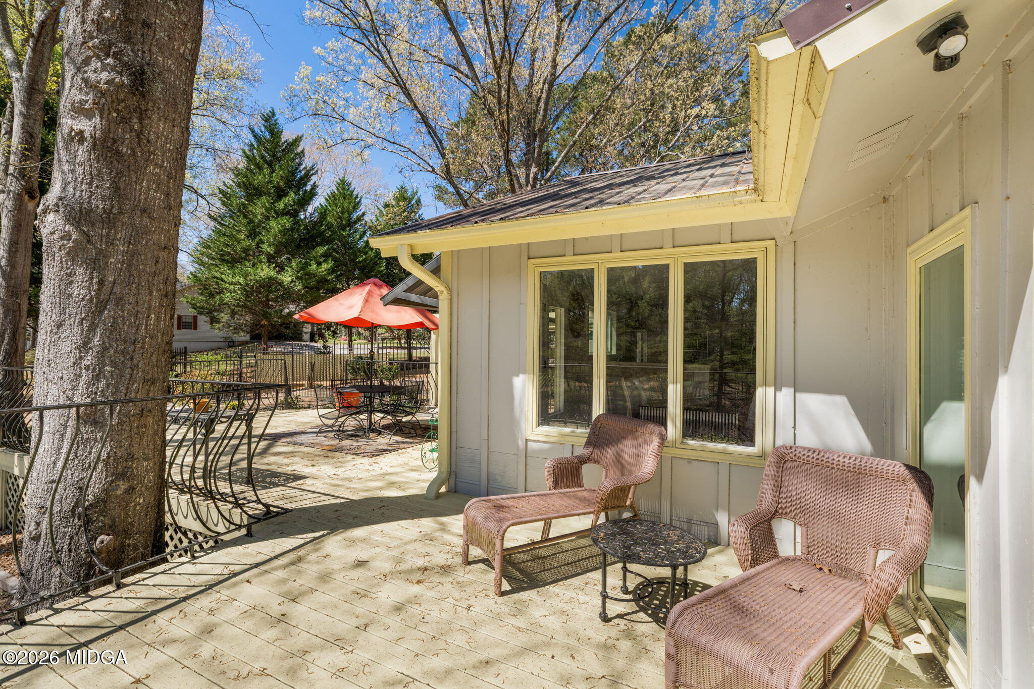 138 Deer Run Drive Macon, GA 31220 - Photo 52 of 114 a view of a patio with table and chairs and floor to ceiling window
