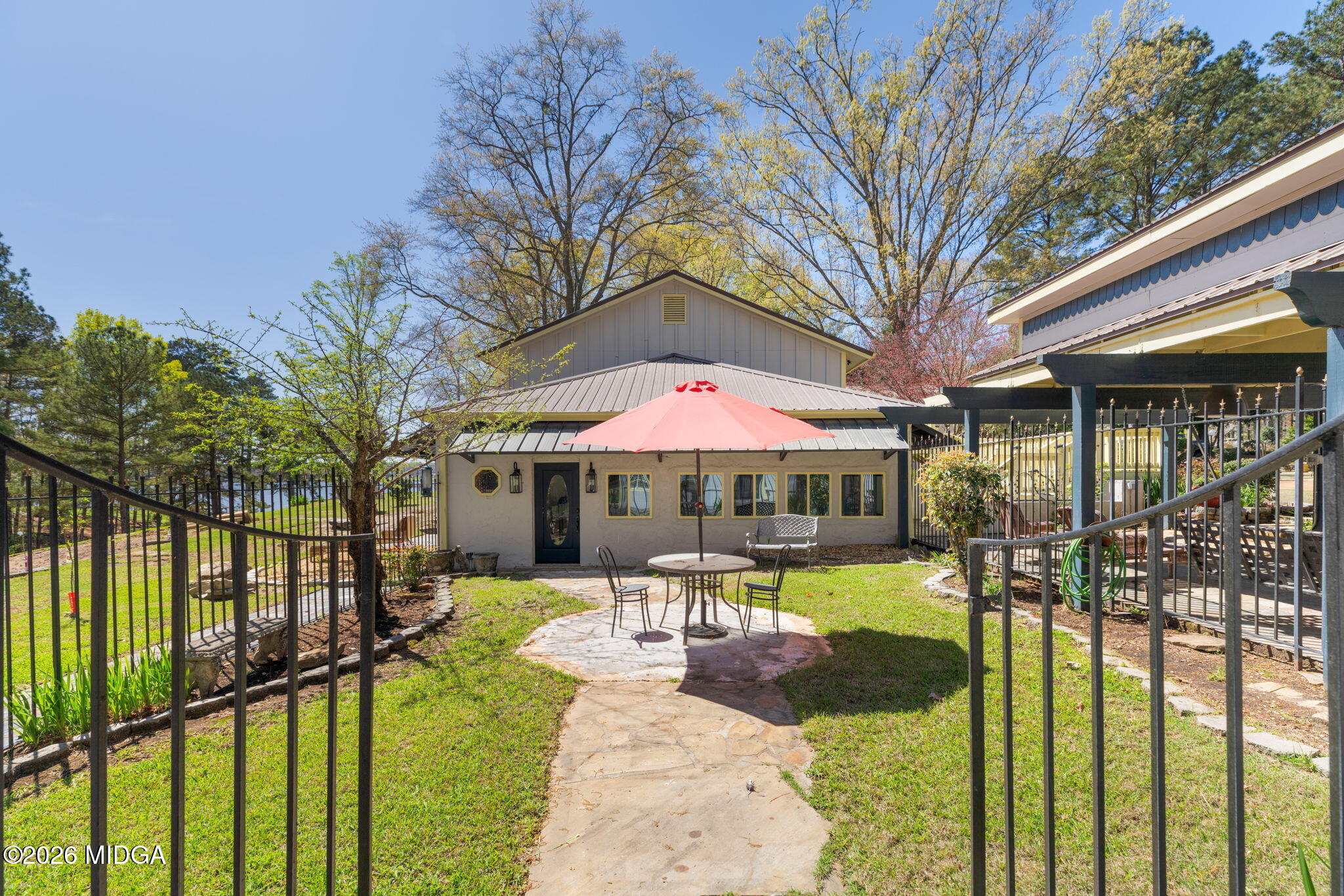 138 Deer Run Drive Macon, GA 31220 - Photo 66 of 114 a view of a patio with a table chairs and a backyard
