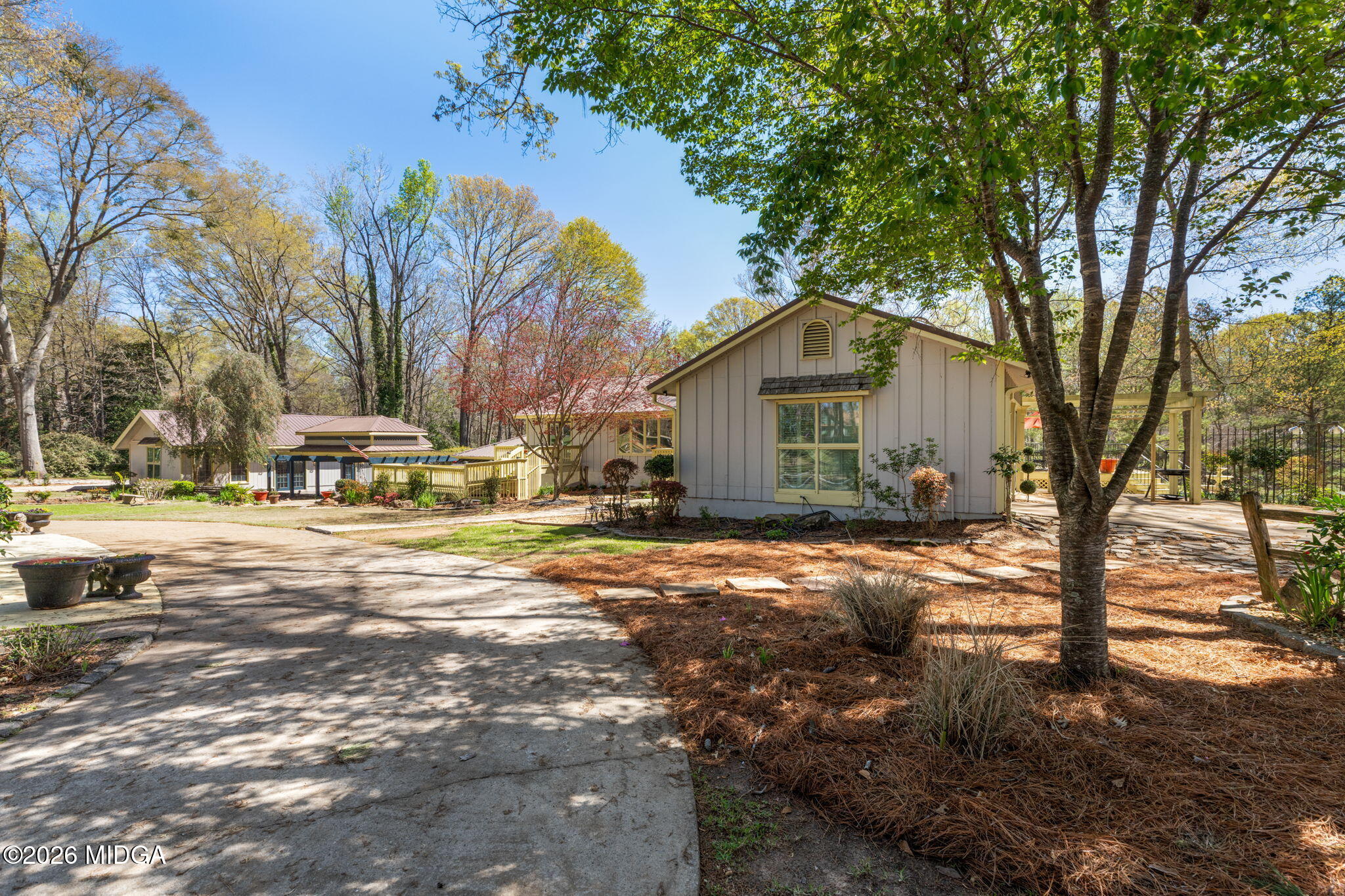 138 Deer Run Drive Macon, GA 31220 - Photo 70 of 114 a front view of a house with a yard and covered with trees