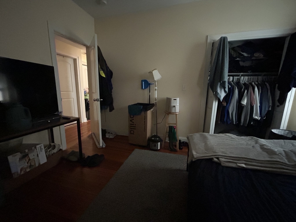 191 Boylston Street, Unit 1 Boston, MA 02130 - Photo 8 of 13 a view of walk in closet with clothes and shoes