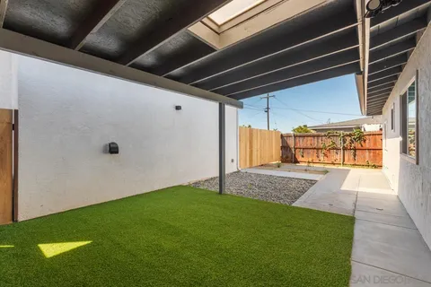 a view of backyard with small cabin
