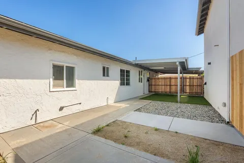 a view of backyard with small cabin