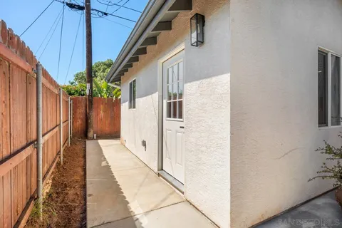 a bathroom with a sink toilet a mirror and shower