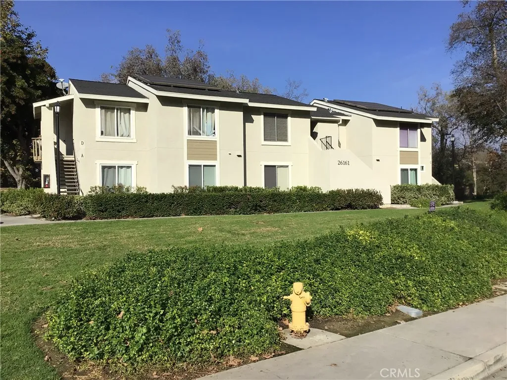 26161 Del Rey, Unit C Mission Viejo, CA 92691 - Photo 11 of 11 a front view of a house with a yard