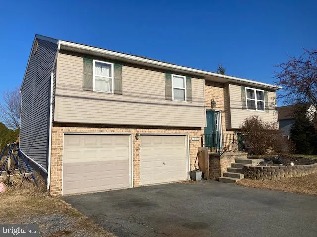 a front view of a house with a garage