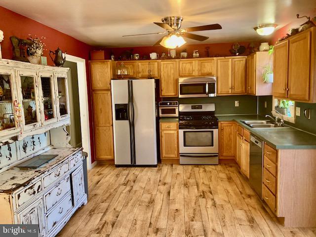 1329 Sheep Hill Road East Earl, PA 17519 - Photo 6 of 15 a kitchen with stainless steel appliances granite countertop a stove top oven a sink and a refrigerator