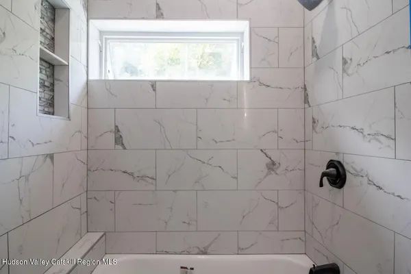 a close up of a bathtub in a bathroom