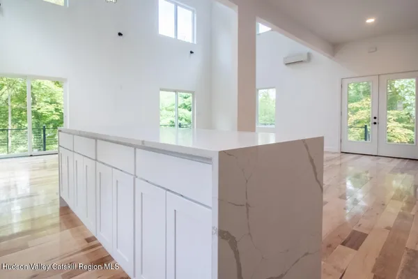 a kitchen with stainless steel appliances a sink a stove a microwave and cabinets