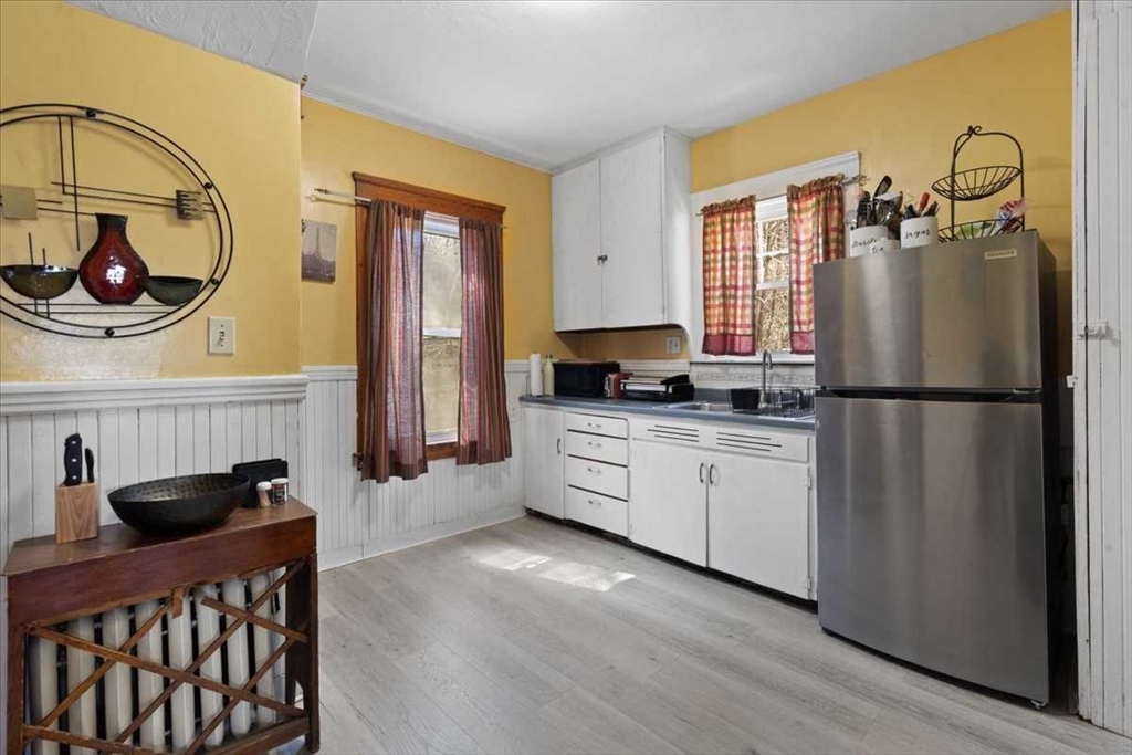18 Joppa Road Worcester, MA 01602 - Photo 11 of 29 a kitchen with stainless steel appliances granite countertop a refrigerator and a stove top oven