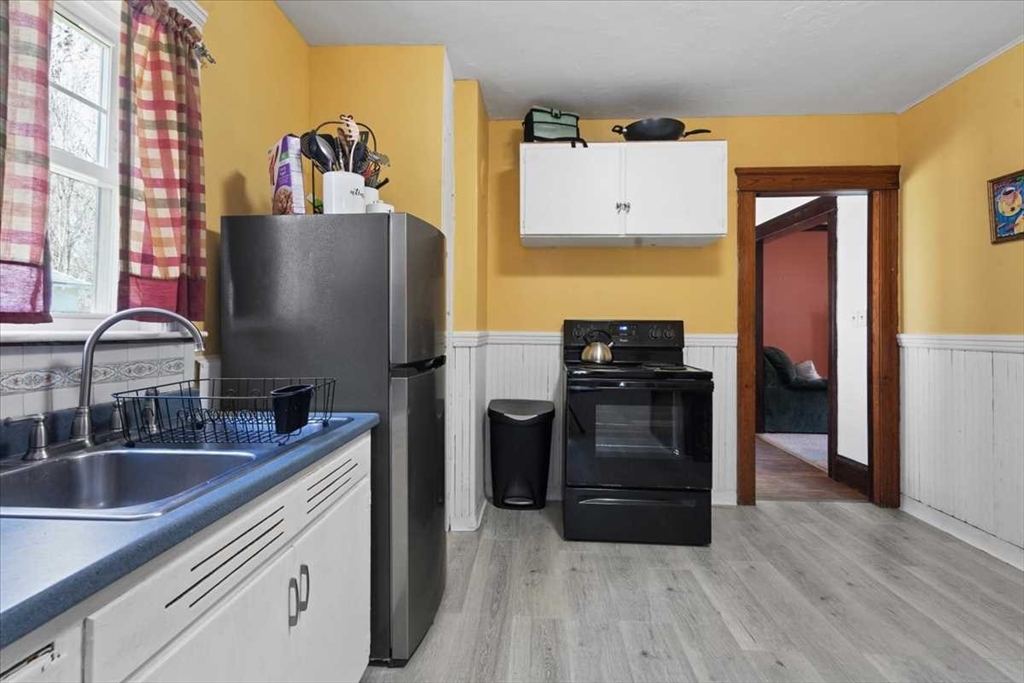 18 Joppa Road Worcester, MA 01602 - Photo 12 of 29 a kitchen with a refrigerator and a sink