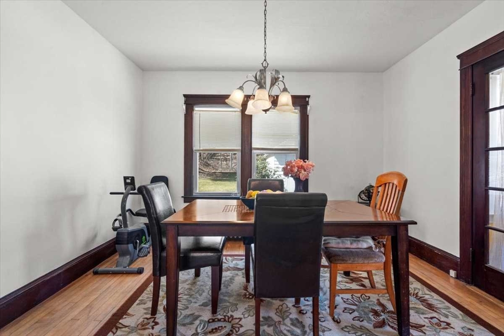 18 Joppa Road Worcester, MA 01602 - Photo 13 of 29 a dining room with furniture a chandelier and wooden floor