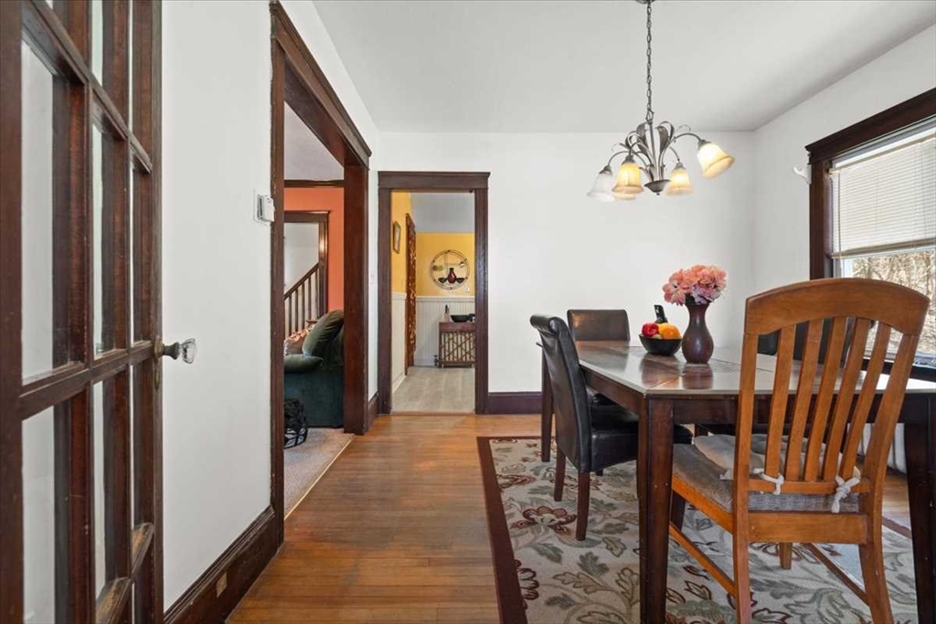 18 Joppa Road Worcester, MA 01602 - Photo 14 of 29 a view of a dining room with furniture chandelier and wooden floor