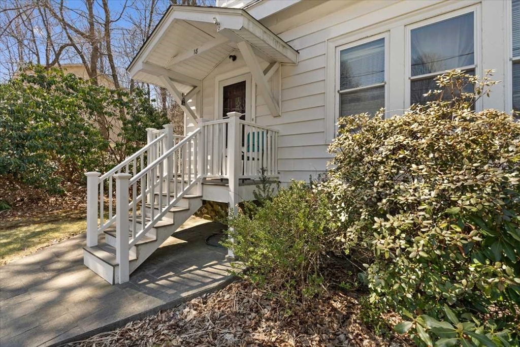 18 Joppa Road Worcester, MA 01602 - Photo 3 of 29 a view of a house with a small yard and flower plants