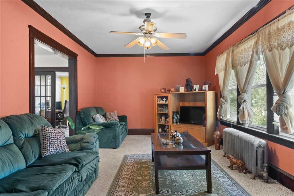 18 Joppa Road Worcester, MA 01602 - Photo 9 of 29 a living room with furniture and a chandelier