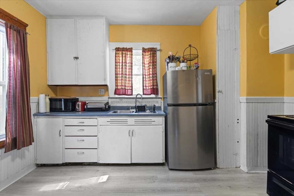18 Joppa Road Worcester, MA 01602 - Photo 10 of 29 a kitchen with a refrigerator and a sink