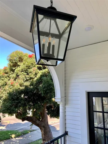 a view of a house with a small yard and wooden fence