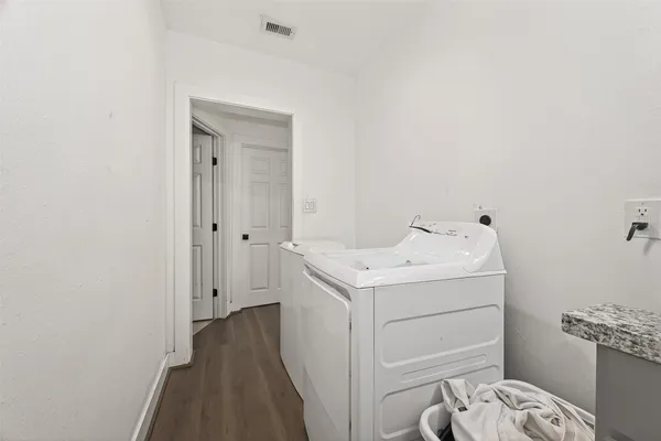 a utility room with dryer and washer