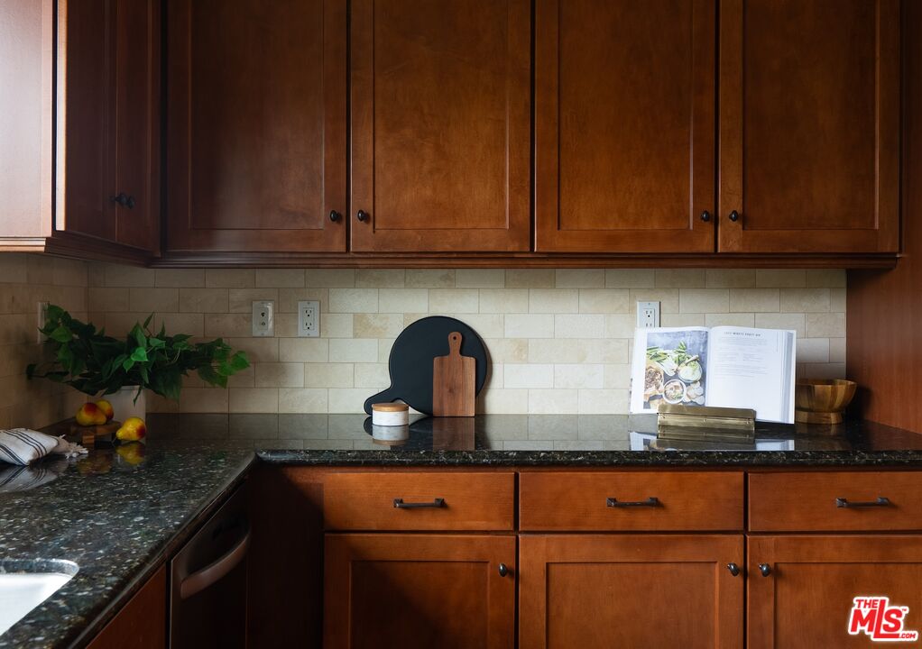 3971 Moore Street, Unit 102 Los Angeles, CA 90066 - Photo 11 of 35 a kitchen with granite countertop stainless steel appliances sink and cabinets
