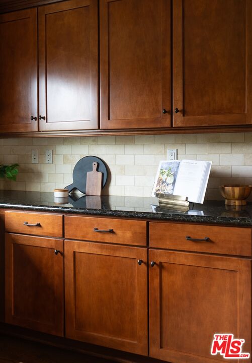 3971 Moore Street, Unit 102 Los Angeles, CA 90066 - Photo 12 of 35 a kitchen with granite countertop cabinets and white appliances