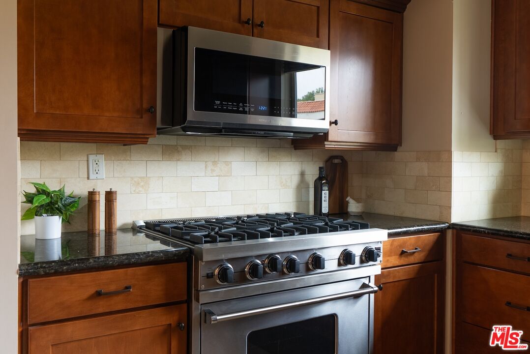 3971 Moore Street, Unit 102 Los Angeles, CA 90066 - Photo 13 of 35 a kitchen with a stove and a microwave