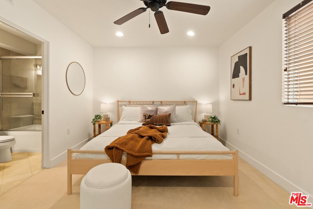 3971 Moore Street, Unit 102 Los Angeles, CA 90066 - Photo 15 of 35 a bed room with a bed and couch