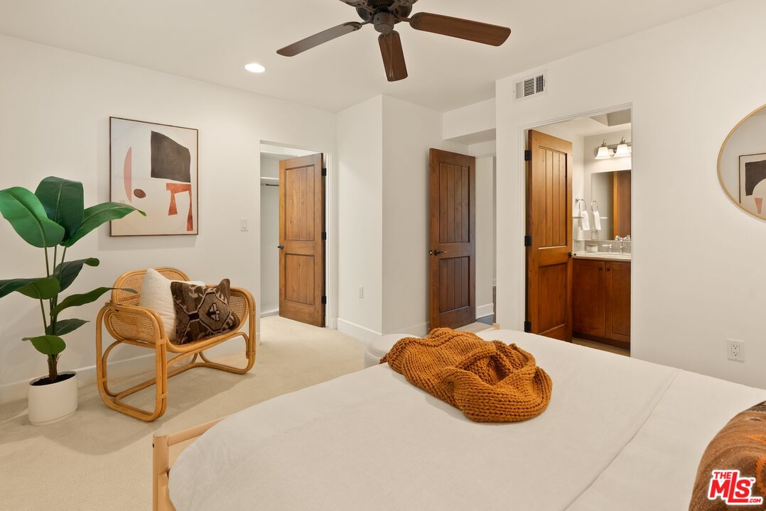 3971 Moore Street, Unit 102 Los Angeles, CA 90066 - Photo 16 of 35 a bedroom with a bed and ceiling fan