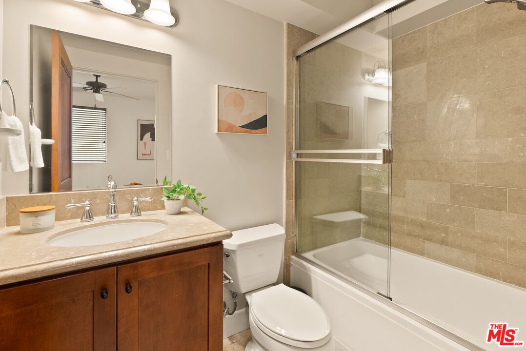 3971 Moore Street, Unit 102 Los Angeles, CA 90066 - Photo 18 of 35 a bathroom with a sink a toilet and shower