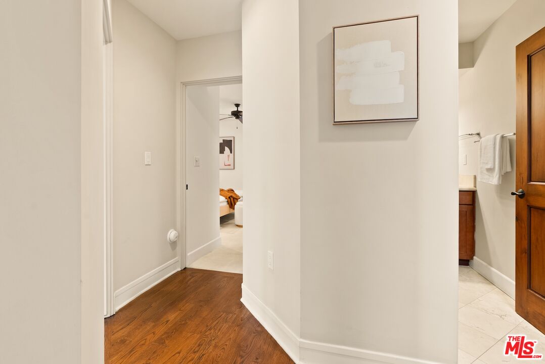 3971 Moore Street, Unit 102 Los Angeles, CA 90066 - Photo 19 of 35 a view of a hallway with wooden floor and closet