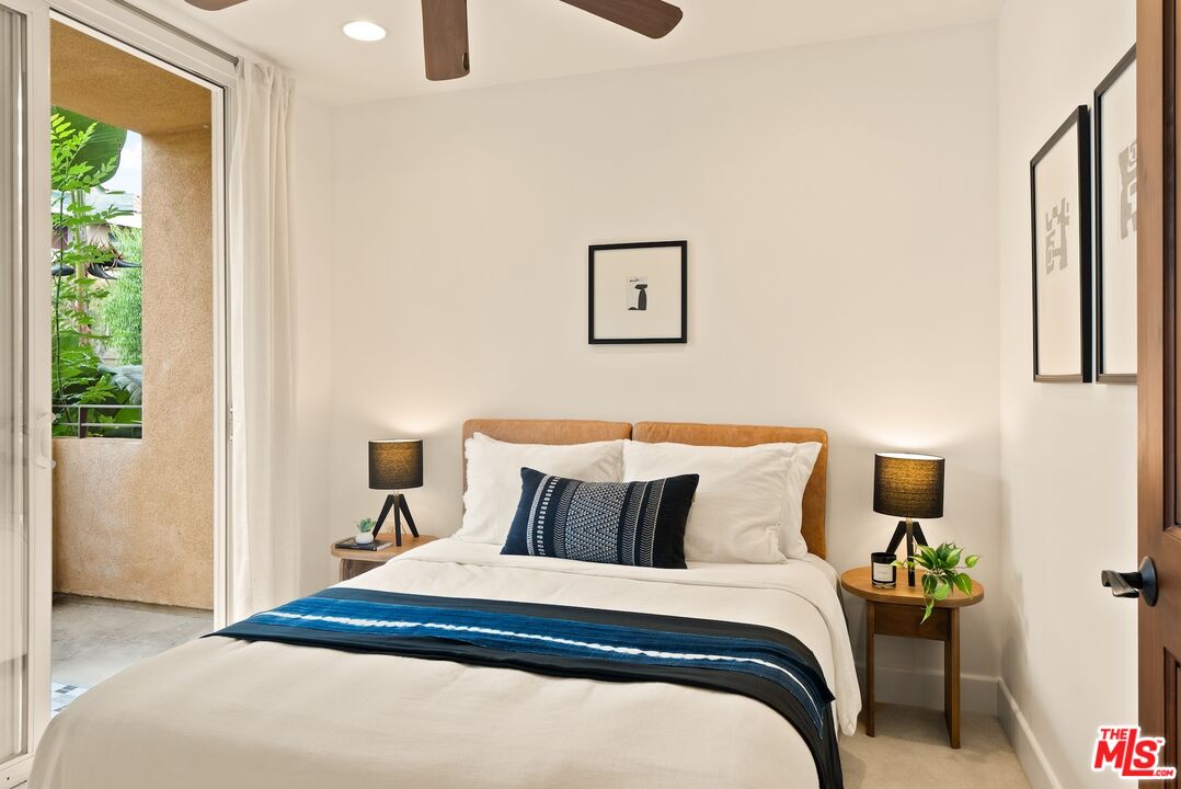 3971 Moore Street, Unit 102 Los Angeles, CA 90066 - Photo 24 of 35 a bedroom with a bed and wooden floor