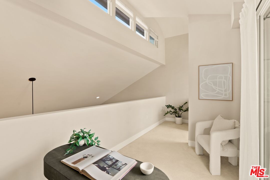 3971 Moore Street, Unit 102 Los Angeles, CA 90066 - Photo 29 of 35 a living room with furniture and flowers