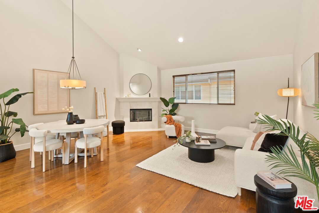 3971 Moore Street, Unit 102 Los Angeles, CA 90066 - Photo 4 of 35 a living room with furniture a fireplace and potted plants