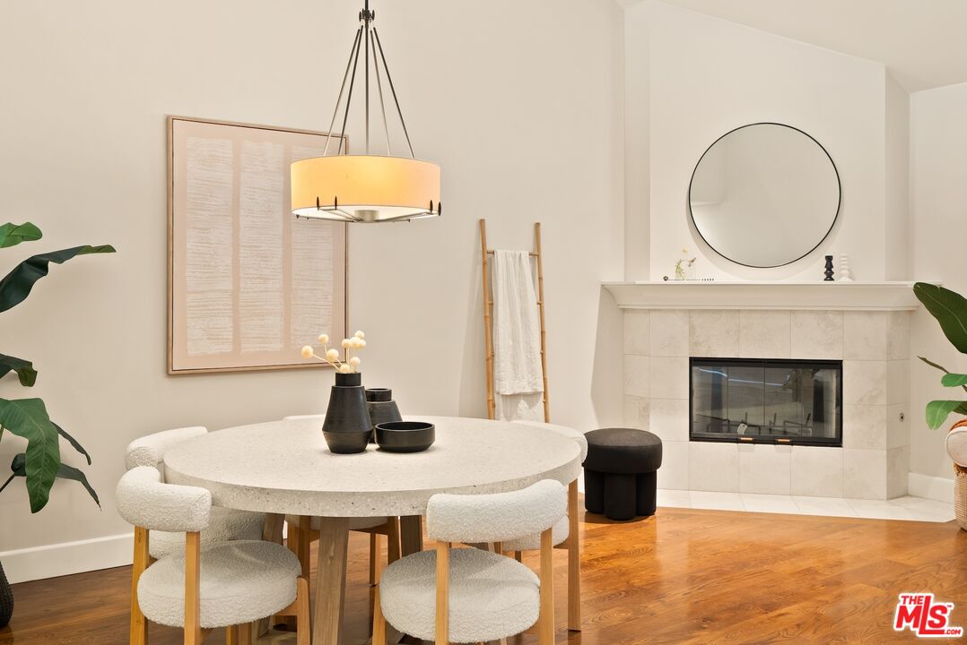 3971 Moore Street, Unit 102 Los Angeles, CA 90066 - Photo 5 of 35 a living room with furniture a table and a fireplace
