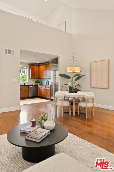 3971 Moore Street, Unit 102 Los Angeles, CA 90066 - Photo 9 of 35 a living room with furniture and a table
