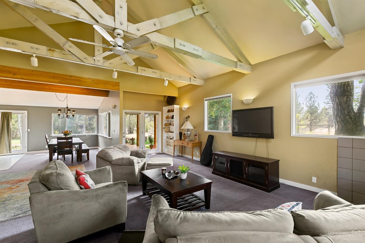 19005 Couch Market Road Bend, OR 97703 - Photo 18 of 22 a living room with furniture and a flat screen tv