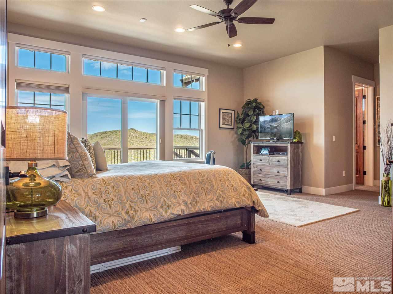 1690 Circle Stone Court Reno, NV 89523 - Photo 18 of 40 a bed sitting in a spacious bedroom next to a window