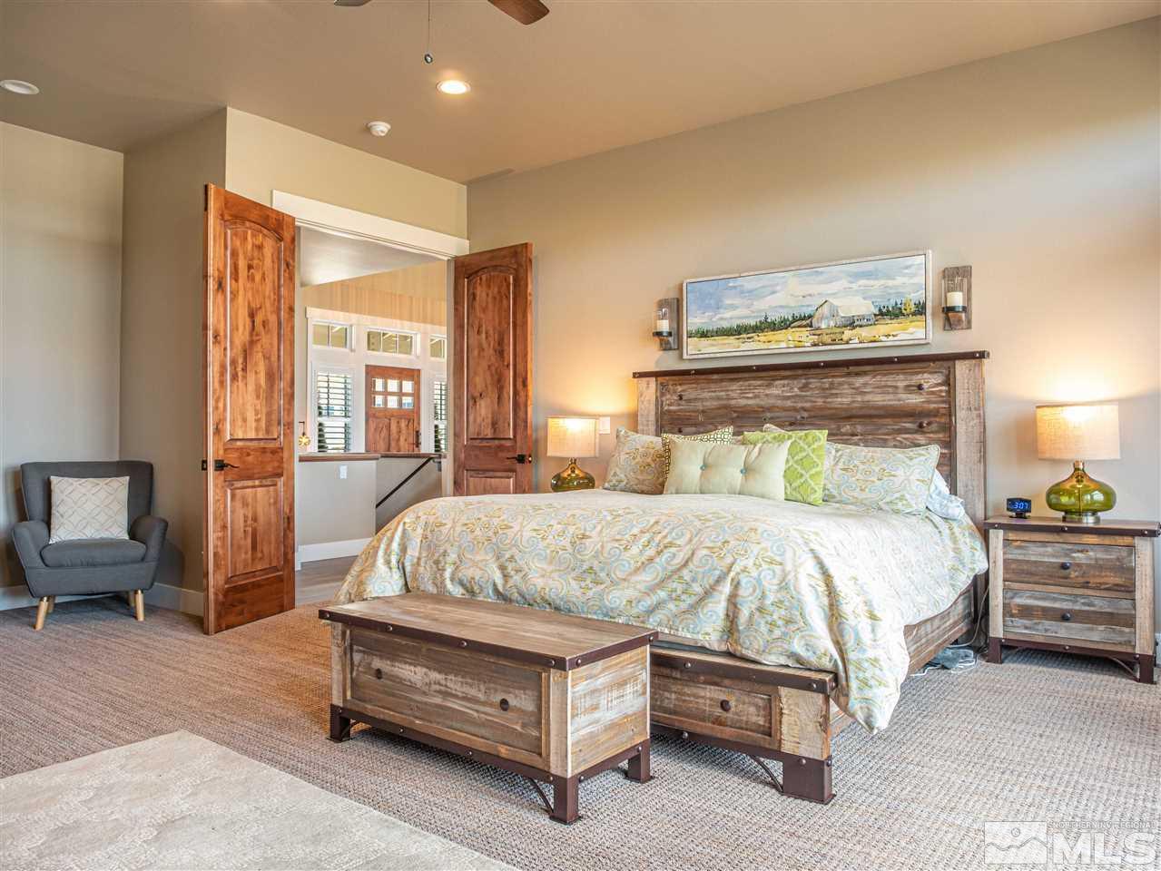 1690 Circle Stone Court Reno, NV 89523 - Photo 19 of 40 a bedroom with a bed and wooden floor