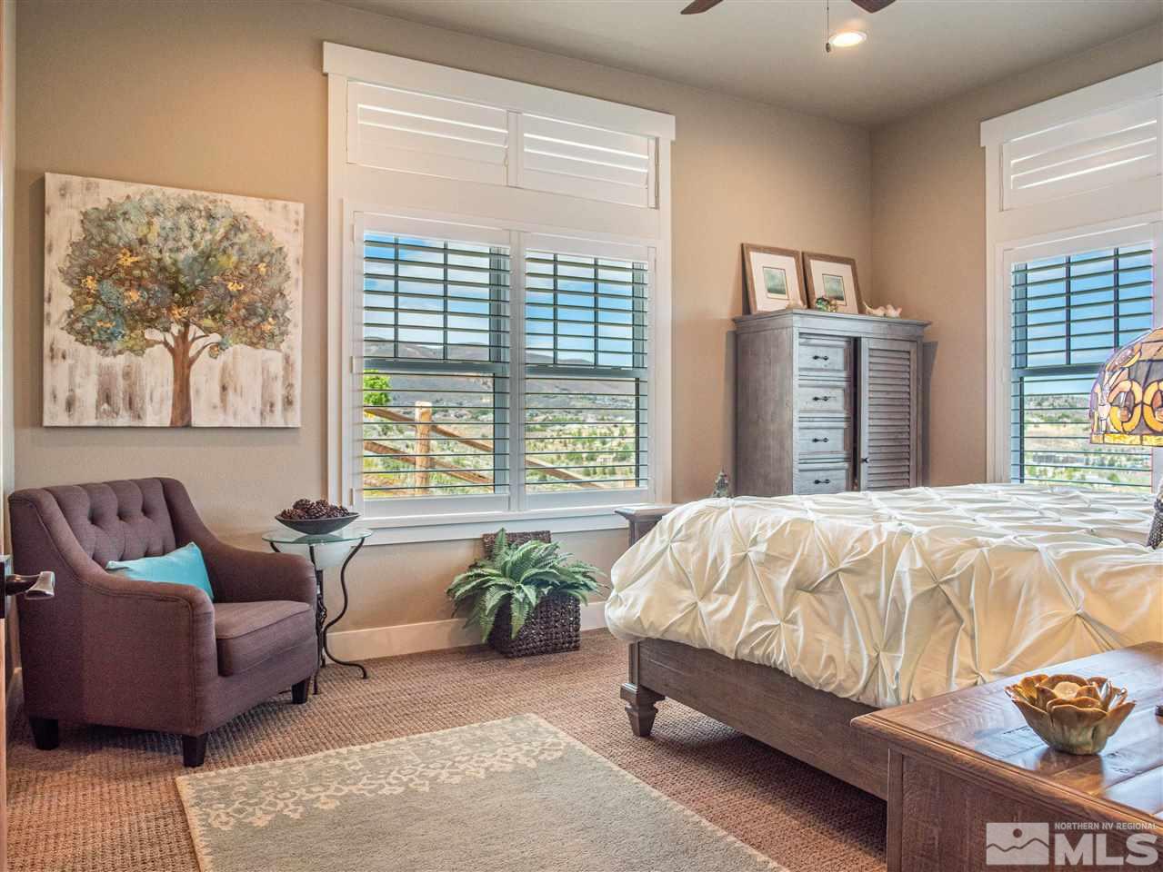 1690 Circle Stone Court Reno, NV 89523 - Photo 20 of 40 a bed sitting in a spacious bedroom next to a window