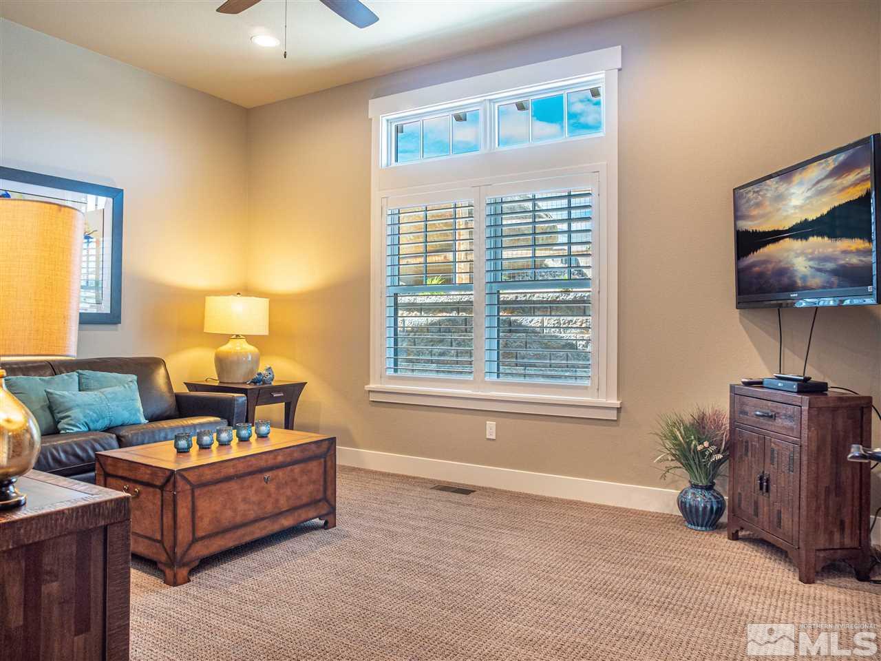 1690 Circle Stone Court Reno, NV 89523 - Photo 21 of 40 a living room with furniture and a flat screen tv