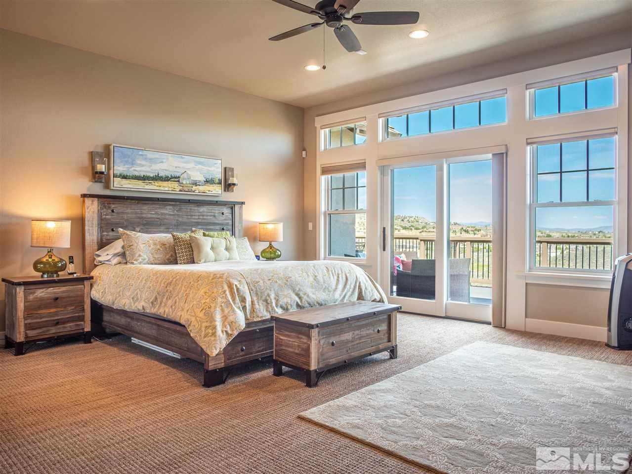 1690 Circle Stone Court Reno, NV 89523 - Photo 23 of 40 a bed sitting in a bedroom next to a window