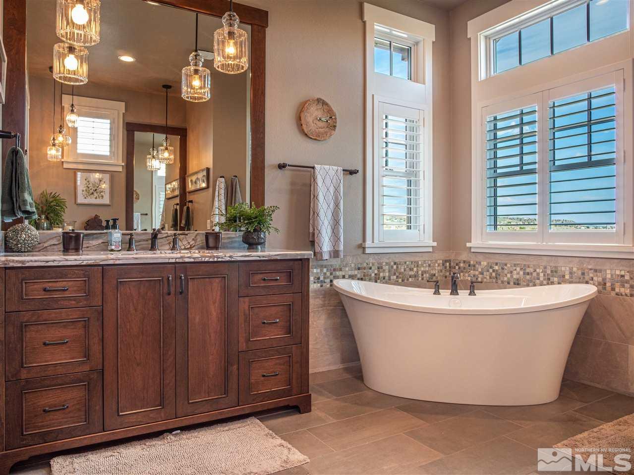 1690 Circle Stone Court Reno, NV 89523 - Photo 24 of 40 a spacious bathroom with a tub sink and mirror